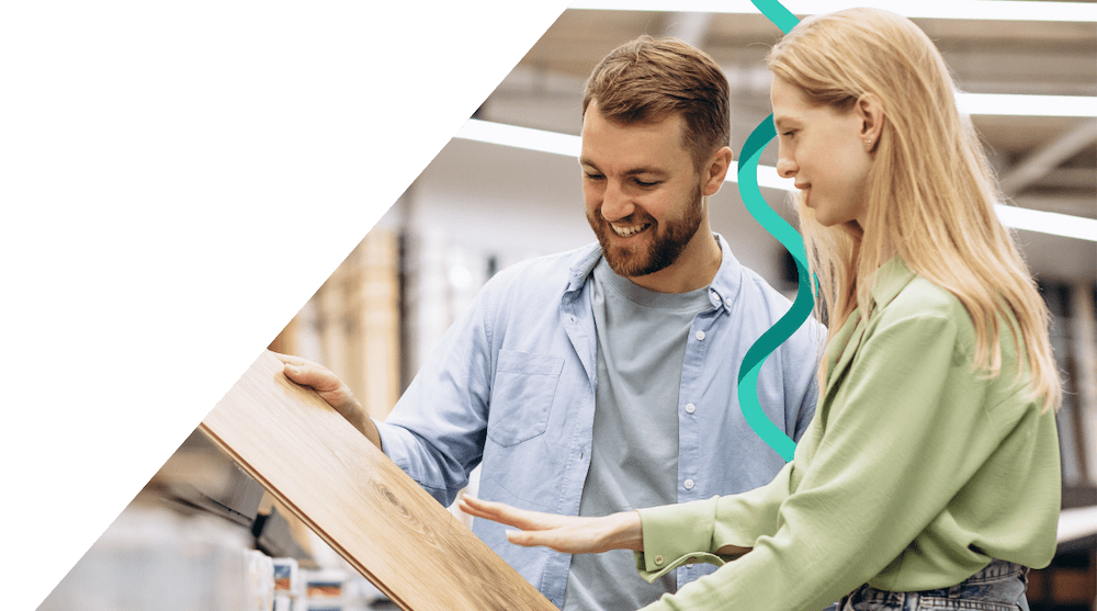 Couple viewing floor samples in DIY store